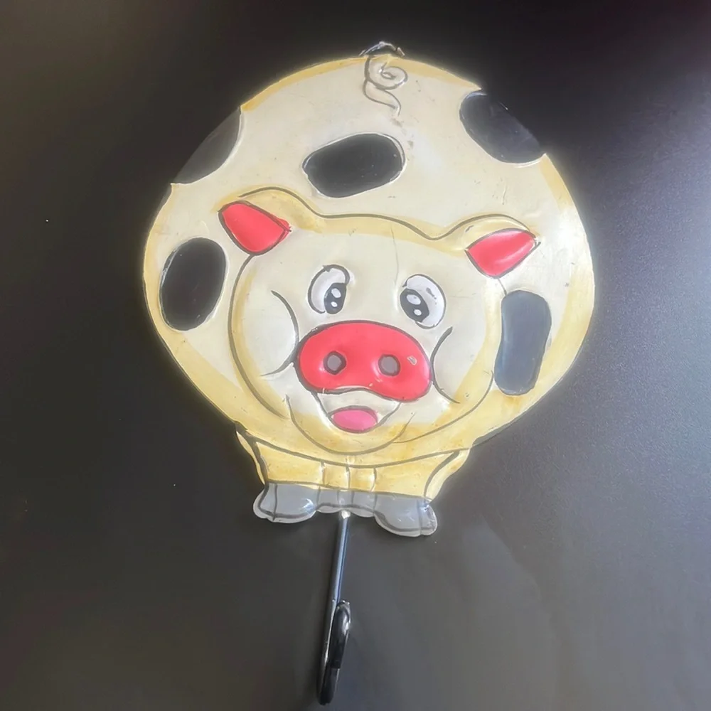 Vintage metal pig sign with hook